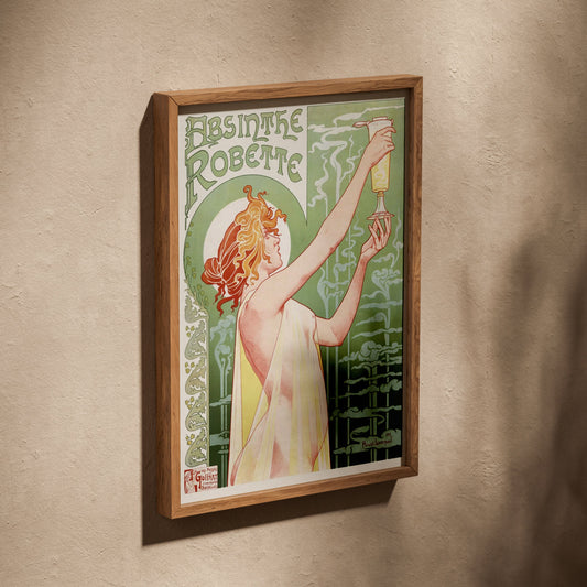 Absinthe Robette - Privat-Livemont, affiche dans un cadre en chêne posé de biais sur un mur texturé