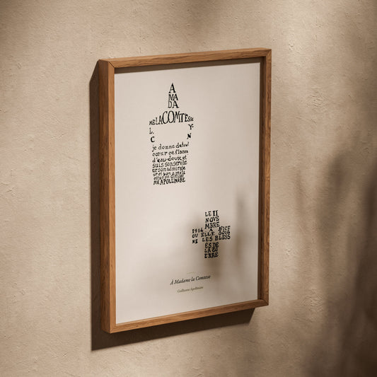 À Madame la Comtesse - Apollinaire - Affiche Calligramme Lou, affiche dans un cadre en chêne posé de biais sur un mur texturé