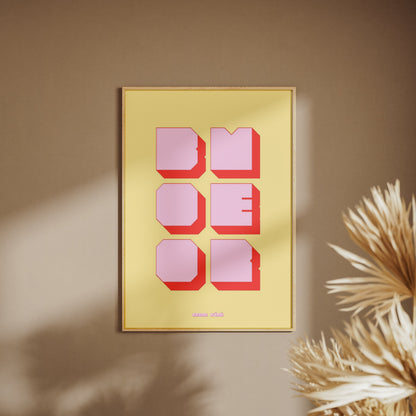 Affiche graphique Boomer, affiche encadrée sur un mur beige, pampas au premier plan