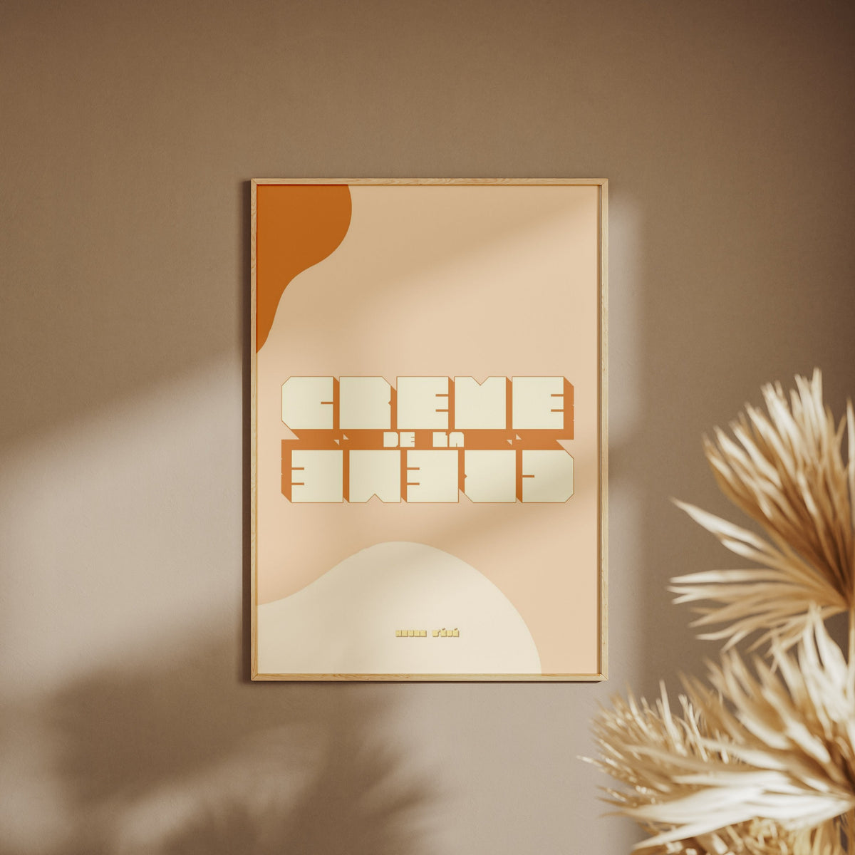 Crème de la Crème | Vintage Poster, framed poster on a beige wall, pampas grass in the foreground