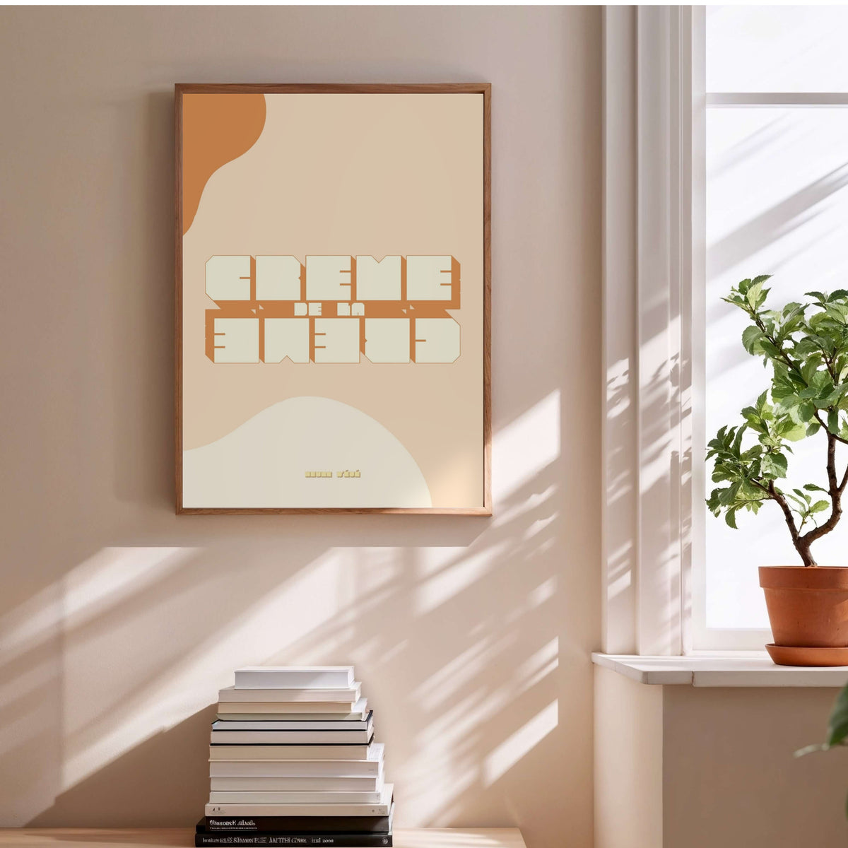 Crème de la Crème | Vintage Poster, framed poster above a stack of books