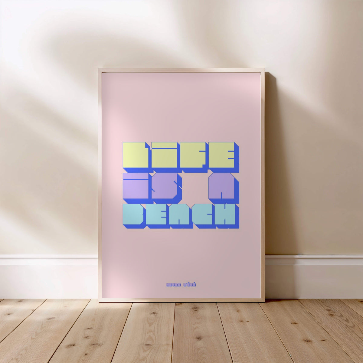 Life is a beach graphic poster, framed poster standing on the floor, light wood frame
