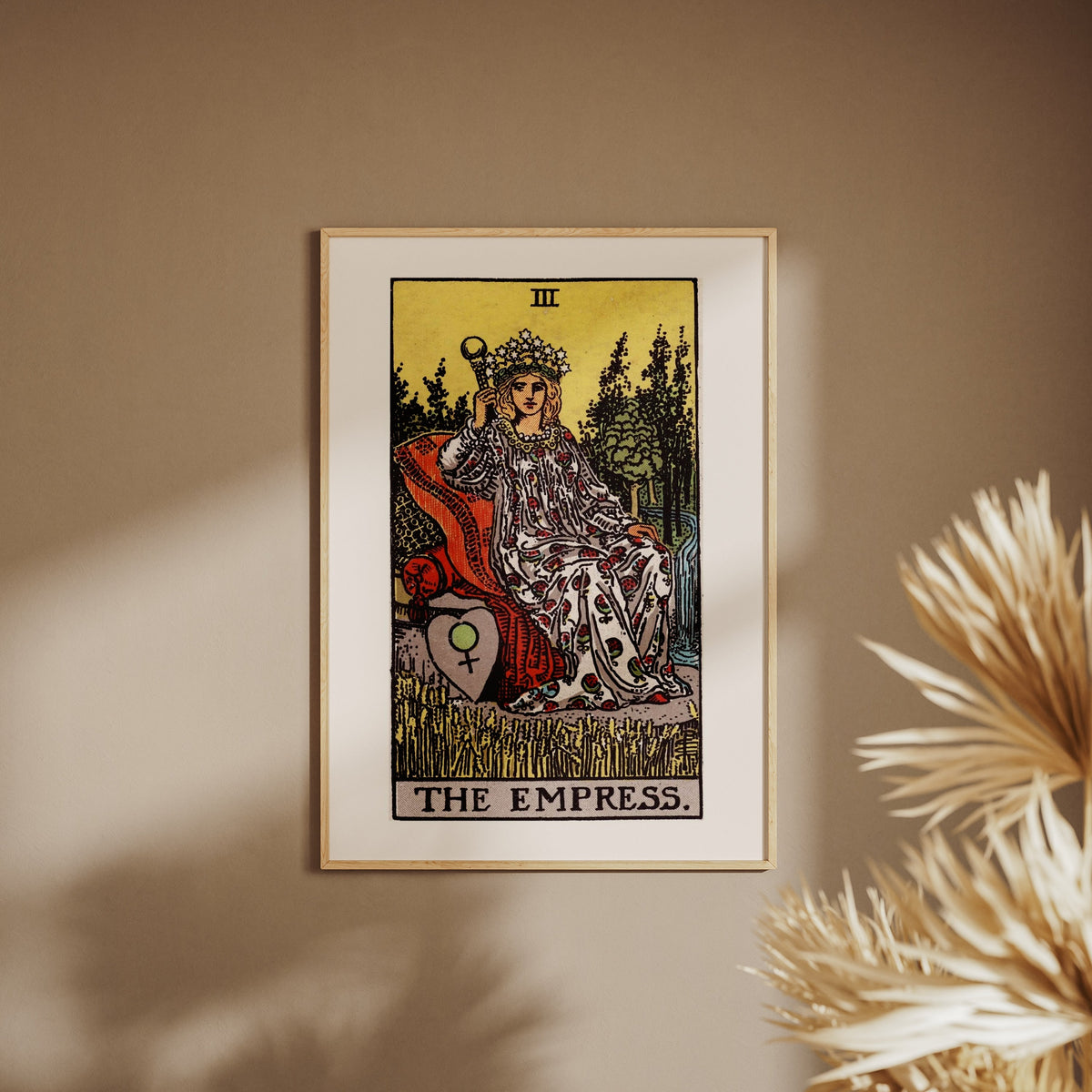 Arcana III - The Empress - Rider-Waite-Smith Tarot Poster, framed poster on a beige wall, pampas grass in the foreground