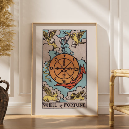 The Wheel of Fortune - Arcana X of the Rider-Waite Tarot, framed poster in an elegant interior, dried grasses and a rattan ch