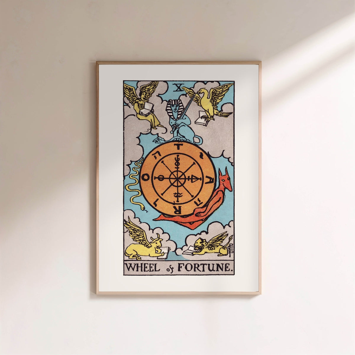 The Wheel of Fortune - Arcana X of the Rider-Waite Tarot, framed poster on a light wall