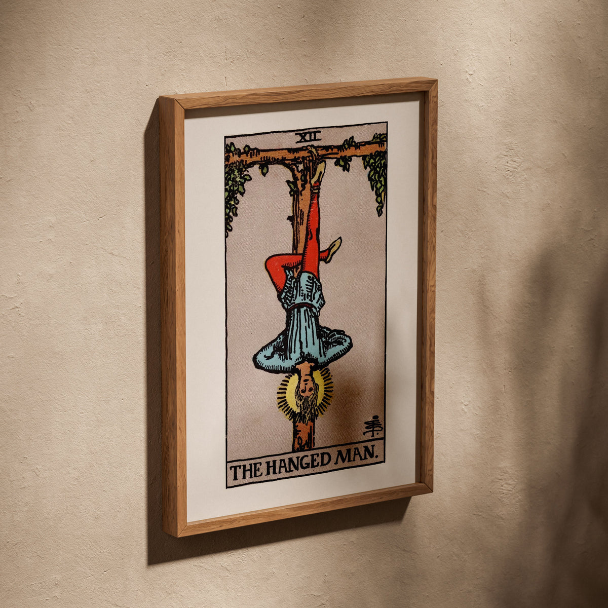 Arcana XII - The Hanged Man - Rider-Waite-Smith Tarot Poster, poster in an oak frame leaning on a textured wall