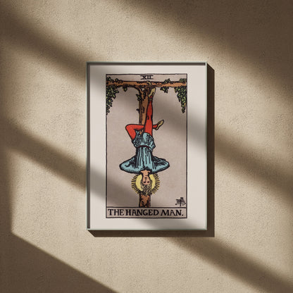 Arcana XII - The Hanged Man - Rider-Waite-Smith Tarot Poster, framed poster on a beige wall, window shadows