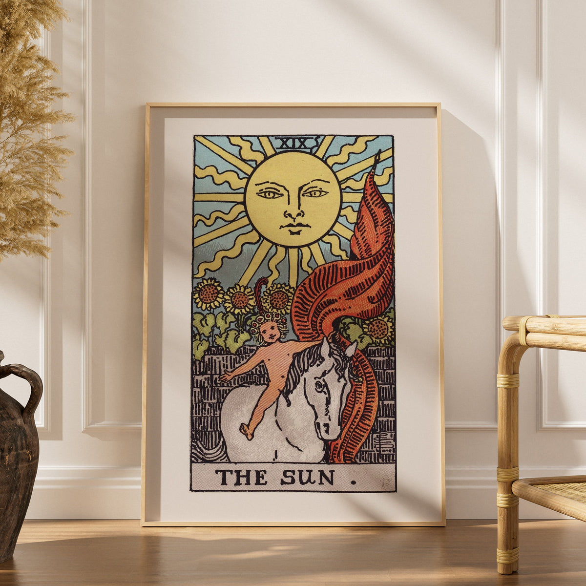 Arcanum XIX - The Sun - Rider-Waite-Smith Tarot Poster, framed poster in an elegant interior, dried grasses and a rattan chai