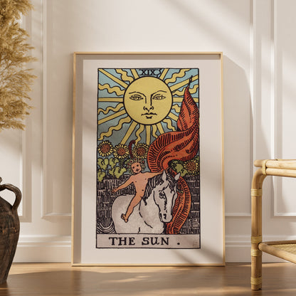 Arcanum XIX - The Sun - Rider-Waite-Smith Tarot Poster, framed poster in an elegant interior, dried grasses and a rattan chai