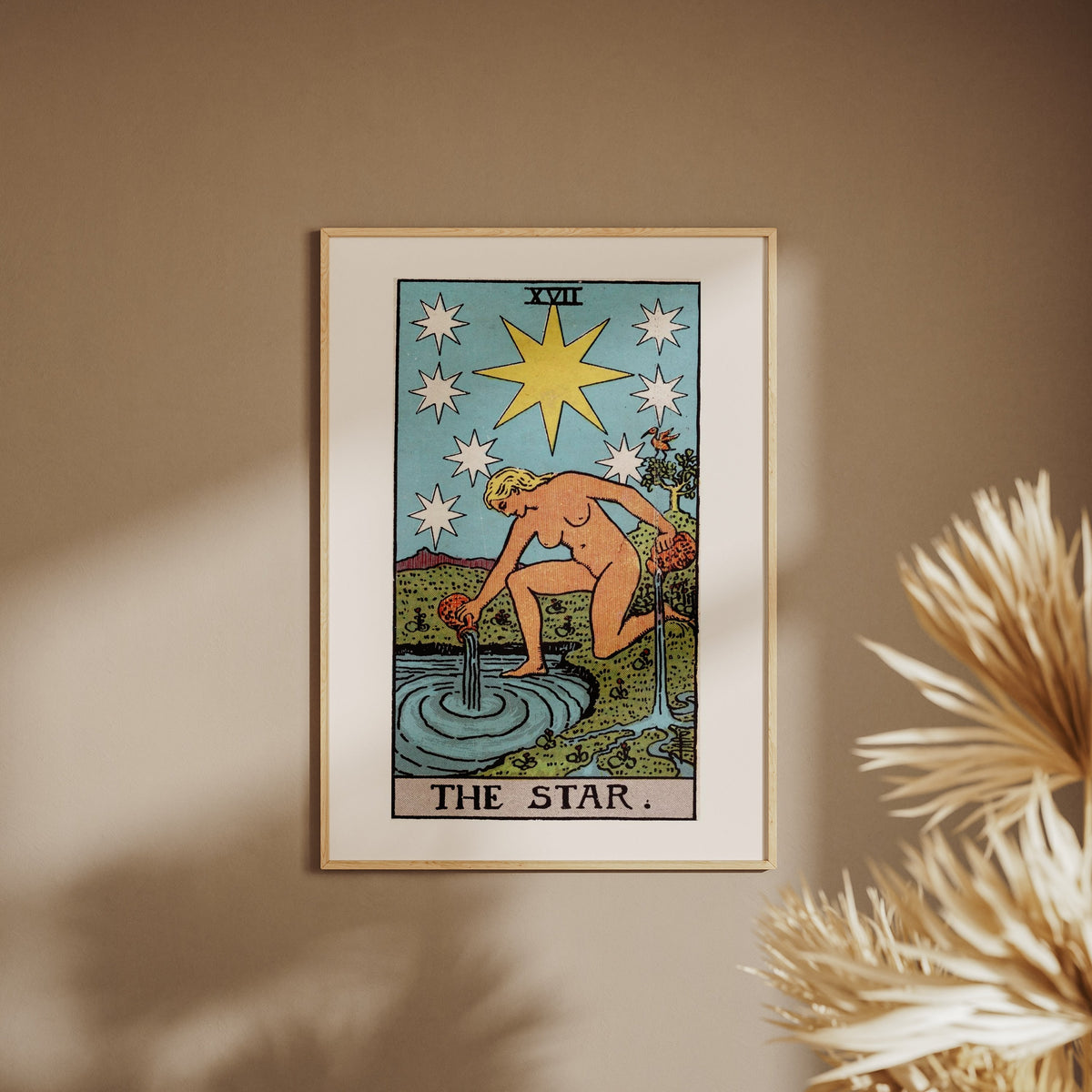 Arcana XVII - The Star - Rider-Waite-Smith Tarot Poster, framed poster on a beige wall, pampas grass in the foreground