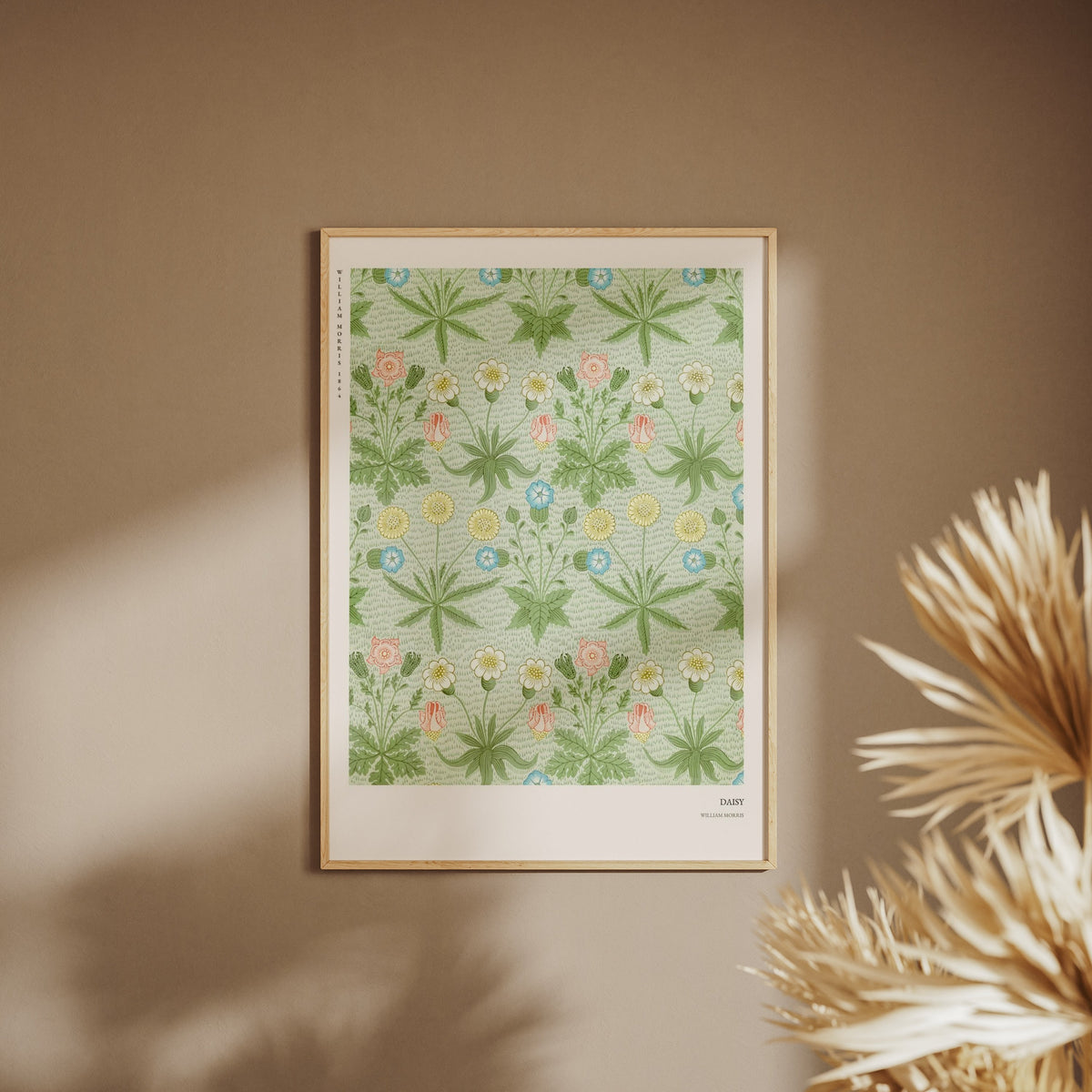 Daisy - William Morris - Arts & Crafts Poster, framed poster on a beige wall, pampas grass in the foreground