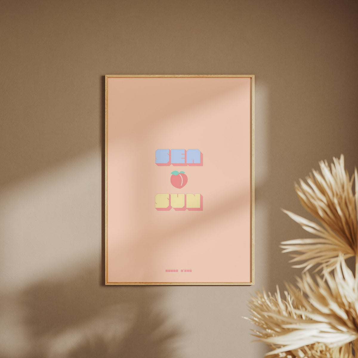 Sea Peach &amp; Sun Poster, framed poster on a beige wall, pampas grass in the foreground