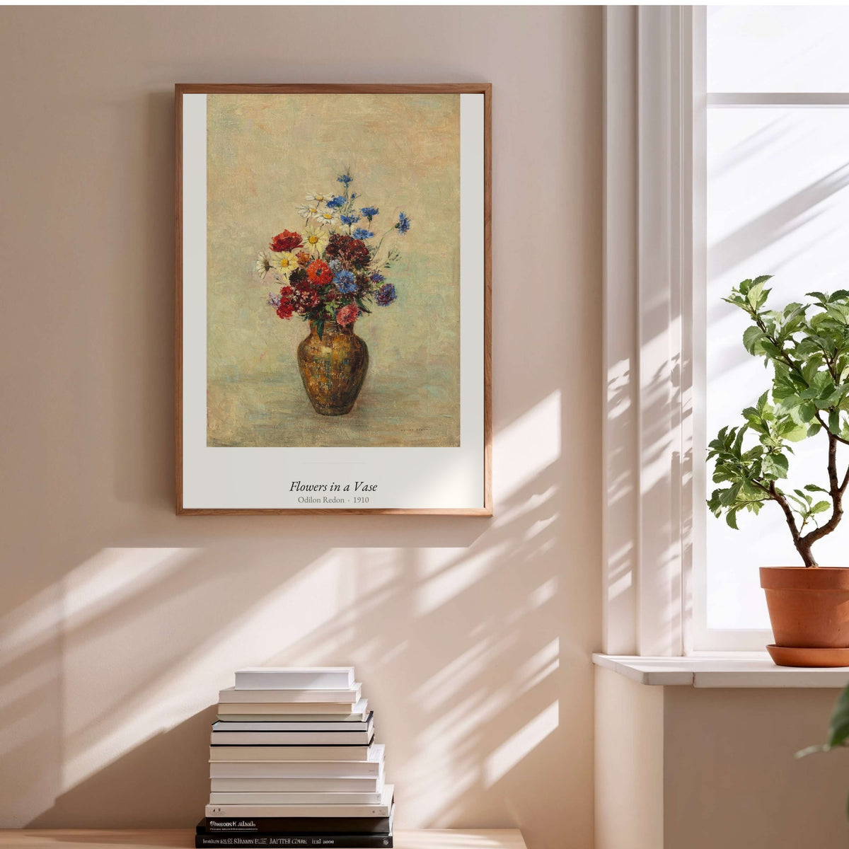 Flowers in a Vase, Odilon Redon | Affiche Art Premium, affiche encadrée au-dessus d'une pile de livres