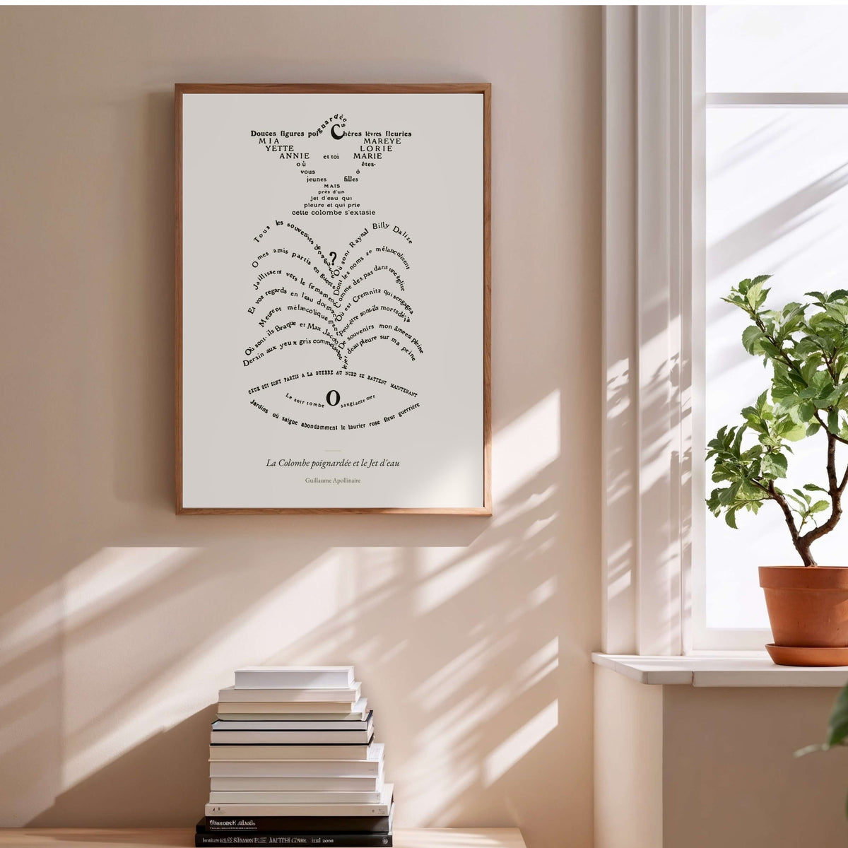 The Stabbed Dove and the Fountain, Apollinaire, framed poster above a stack of books