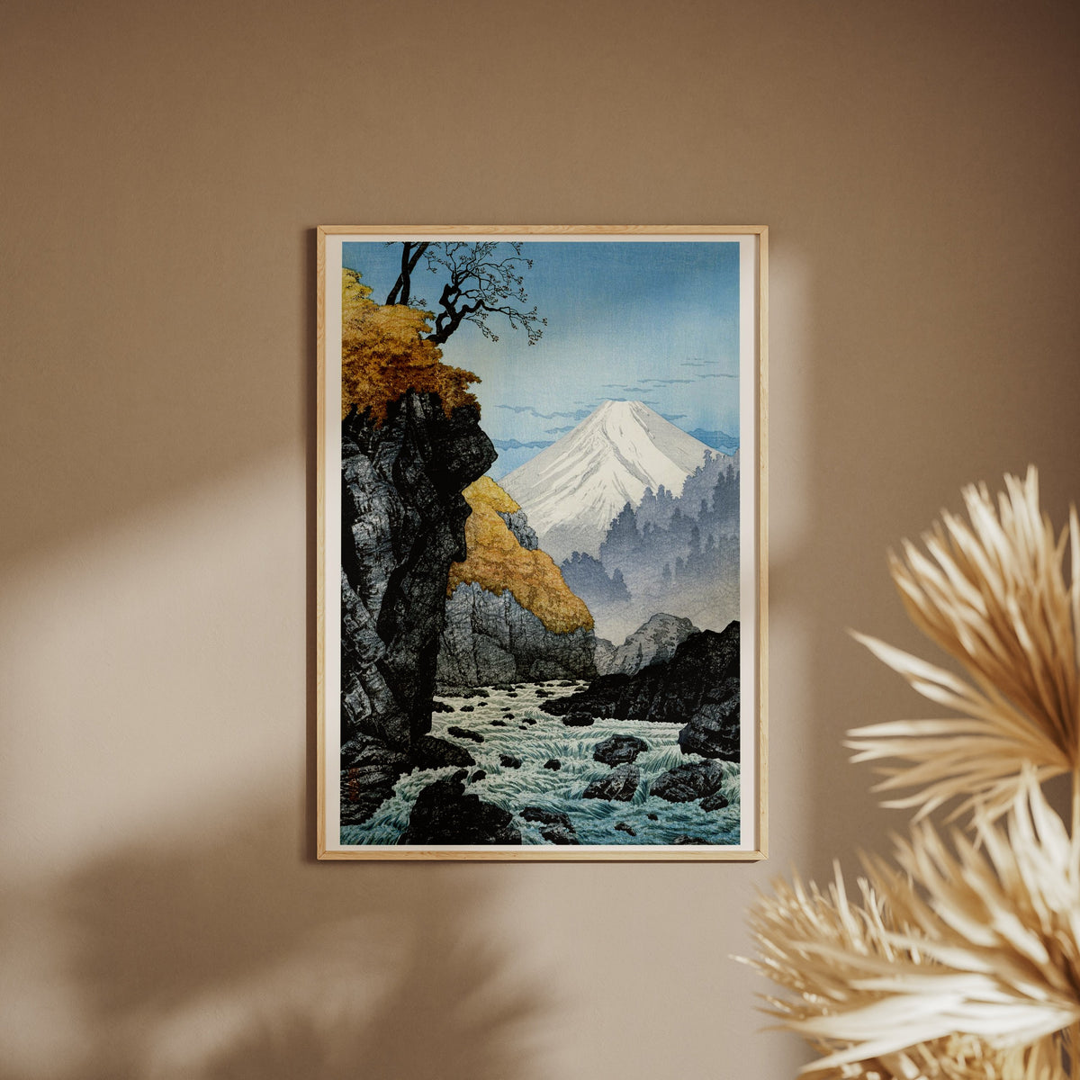 Mount Ashitaka - Hiroaki Takahashi Woodblock Print, framed poster on a beige wall, pampas grass in the foreground