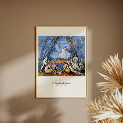 Les Grandes Baigneuses, Paul Cézanne, affiche encadrée sur un mur beige, pampas au premier plan