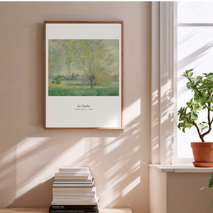 Les Saules, Claude Monet | Affiche Art Premium, affiche encadrée au-dessus d'une pile de livres