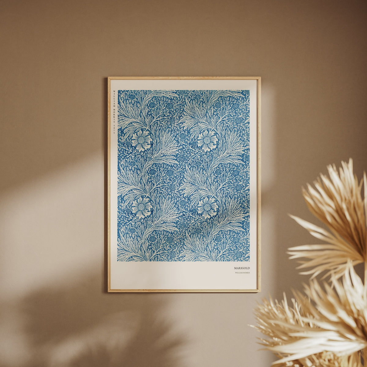 Marigold - William Morris - Arts & Crafts Poster, framed poster on a beige wall, pampas grass in the foreground