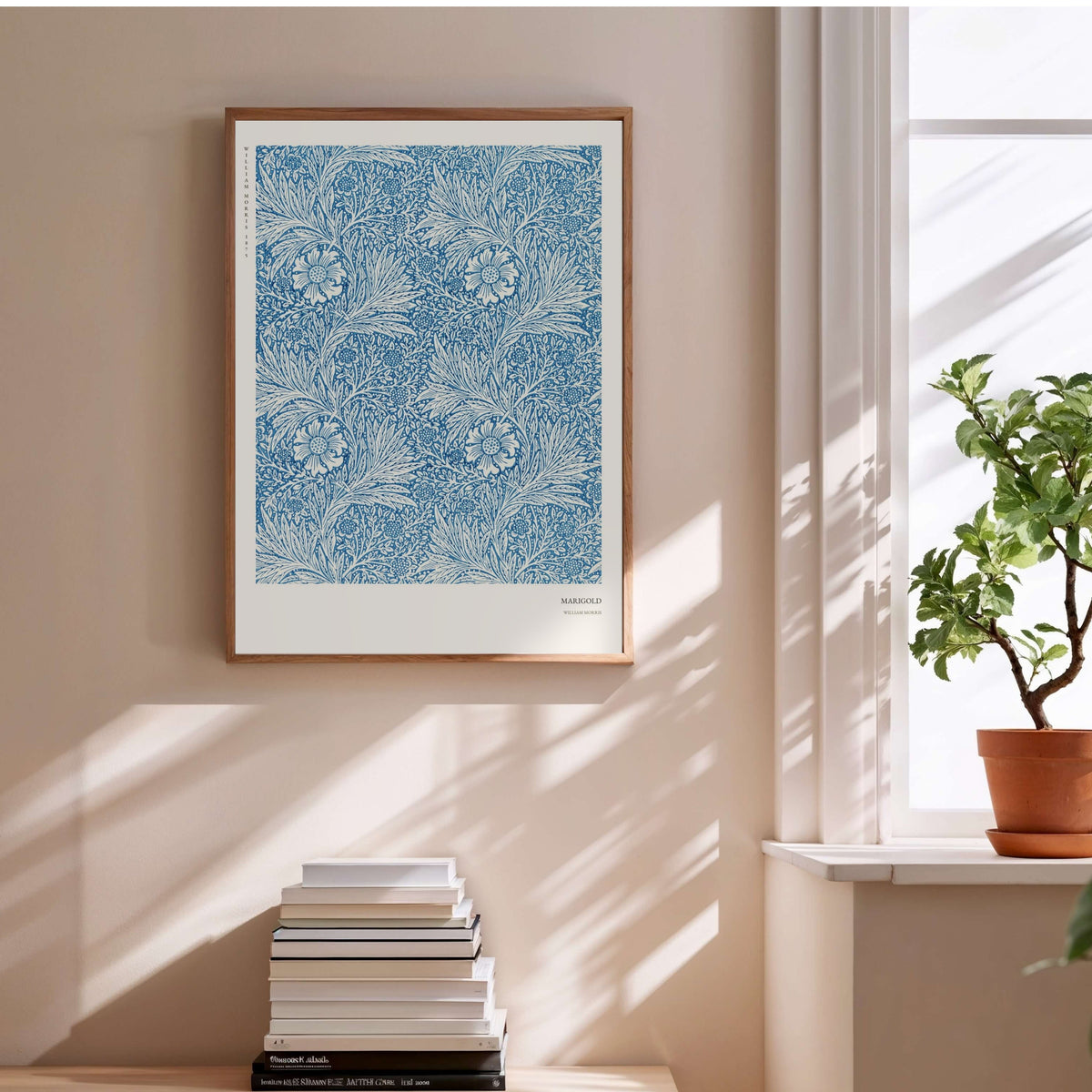 Marigold - William Morris - Arts & Crafts Poster, framed poster above a stack of books
