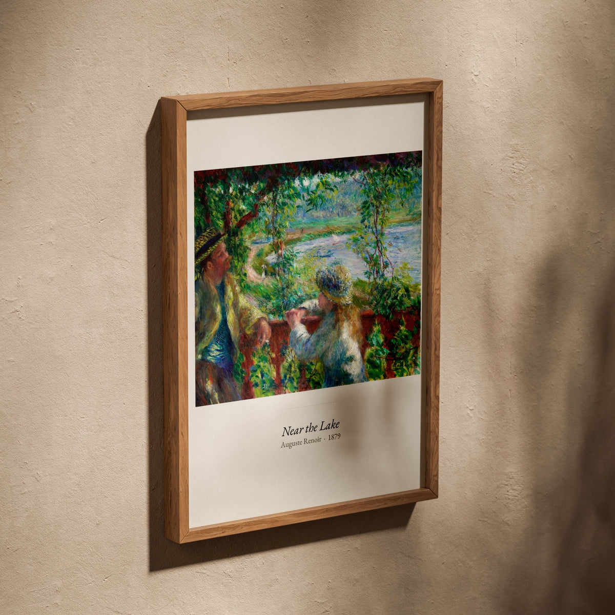 Near the Lake, Auguste Renoir | Affiche Art Premium, affiche dans un cadre en chêne posé de biais sur un mur texturé