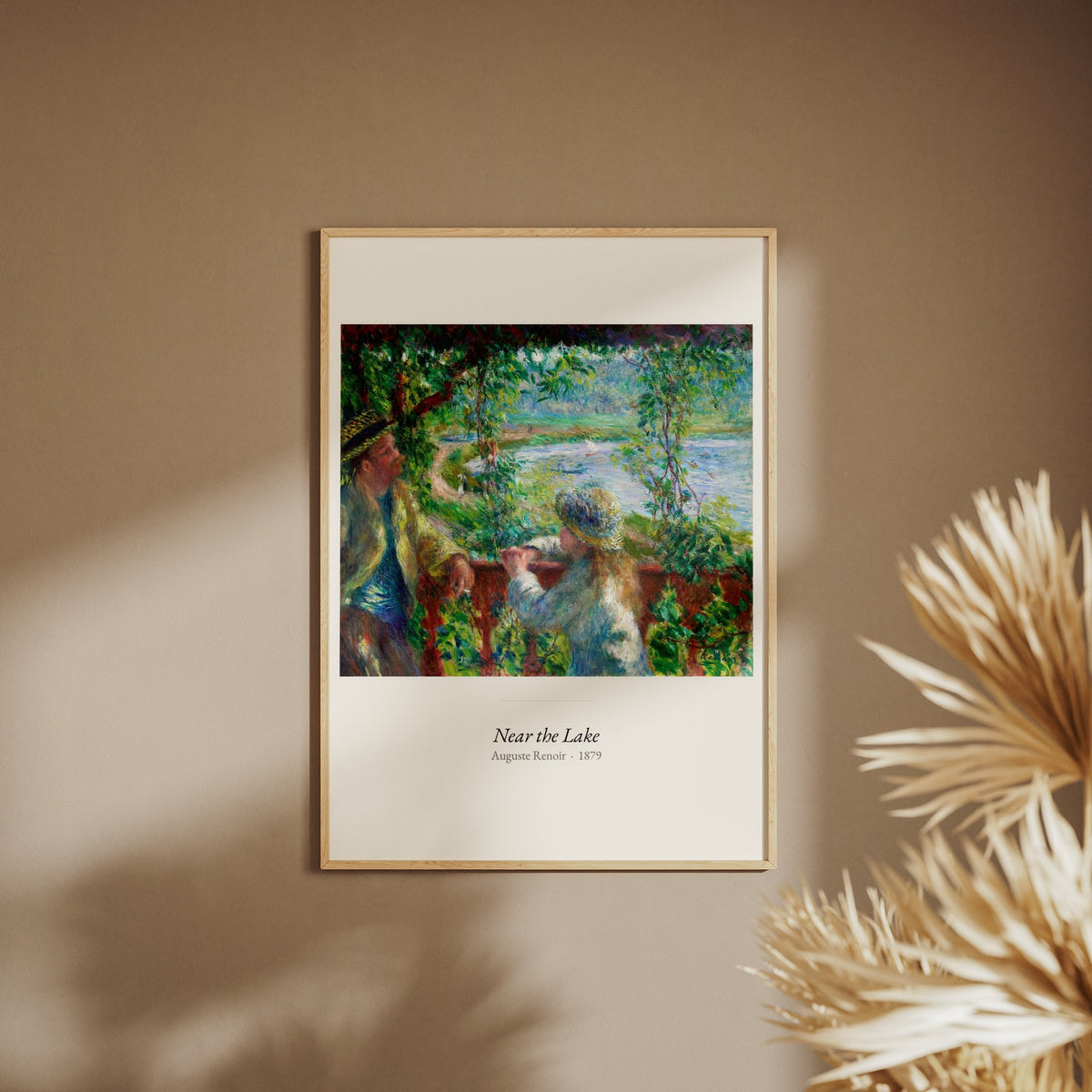 Near the Lake, Auguste Renoir | Affiche Art Premium, affiche encadrée sur un mur beige, pampas au premier plan