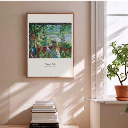 Near the Lake, Auguste Renoir | Affiche Art Premium, affiche encadrée au-dessus d'une pile de livres