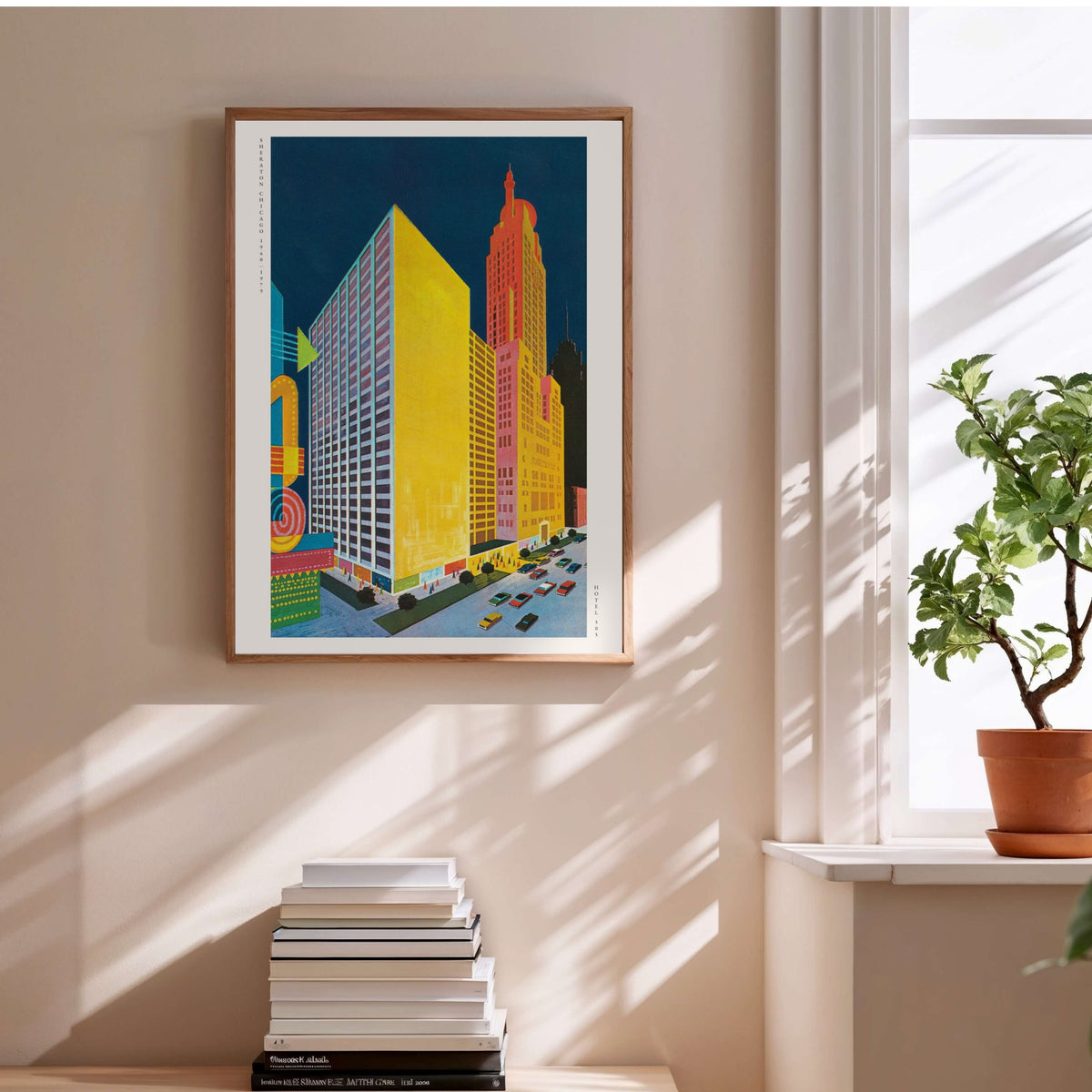 Sheraton Chicago - Vintage Hotel Pop Art Poster, framed poster above a stack of books