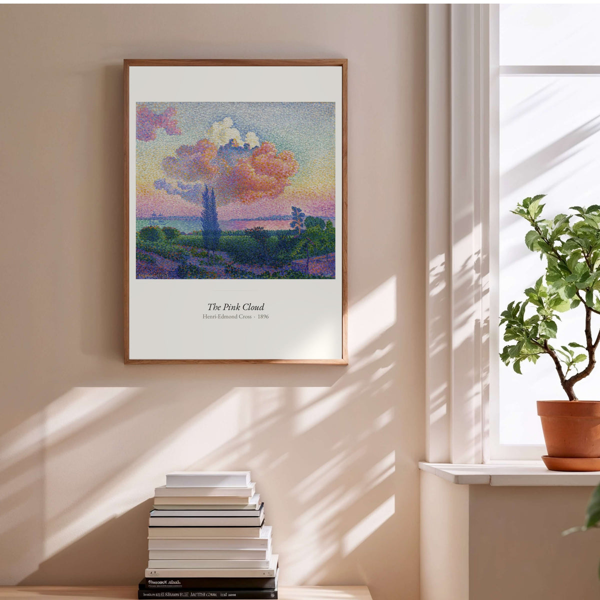 The Pink Cloud, Henri-Edmond Cross, affiche encadrée au-dessus d'une pile de livres
