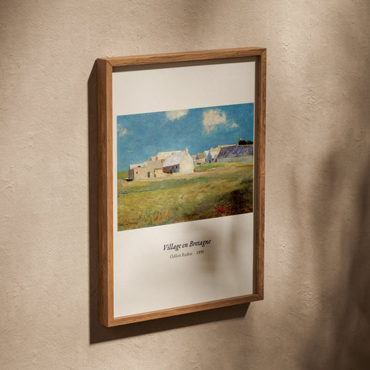Village en Bretagne, Odilon Redon | Affiche Art Premium, affiche dans un cadre en chêne posé de biais sur un mur texturé