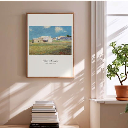Village en Bretagne, Odilon Redon | Affiche Art Premium, affiche encadrée au-dessus d'une pile de livres